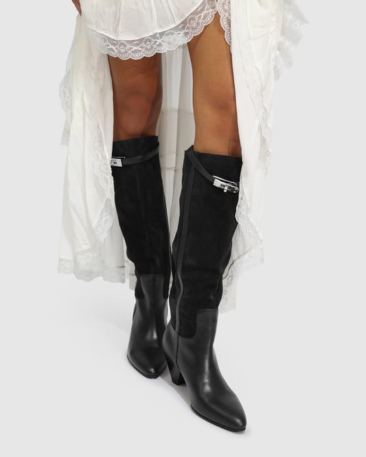Black Wild Thing Knee-High Boots with zip closure and removable strap detailing with hardware - front view
