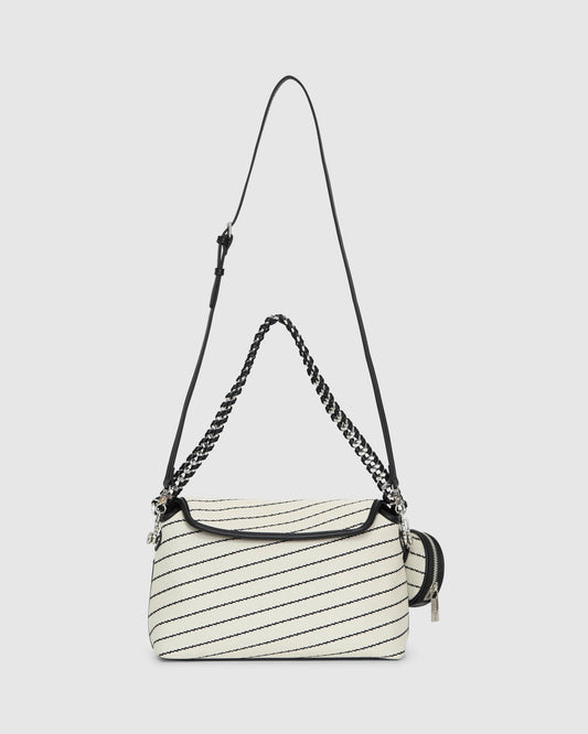 White/Black Elodie Day PU Bag with flap-front design with magnetic snap closure and woven chain shoulder strap for a
